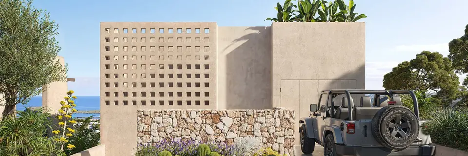 Eingang der Villa mit Betongitter und Trockenmauer